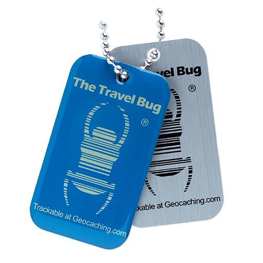 A geocaching travel Bug with its tag and note Stock Photo